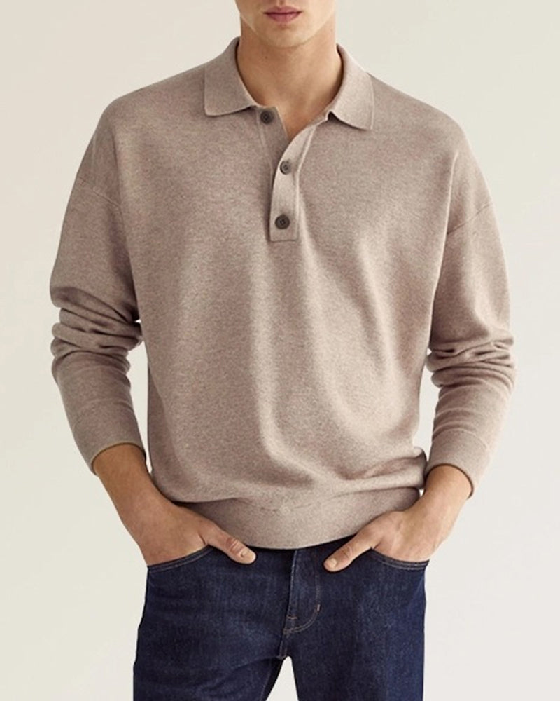 Taupe long-sleeve knit polo with a relaxed dropped-shoulder fit, ribbed collar, and two-button placket.