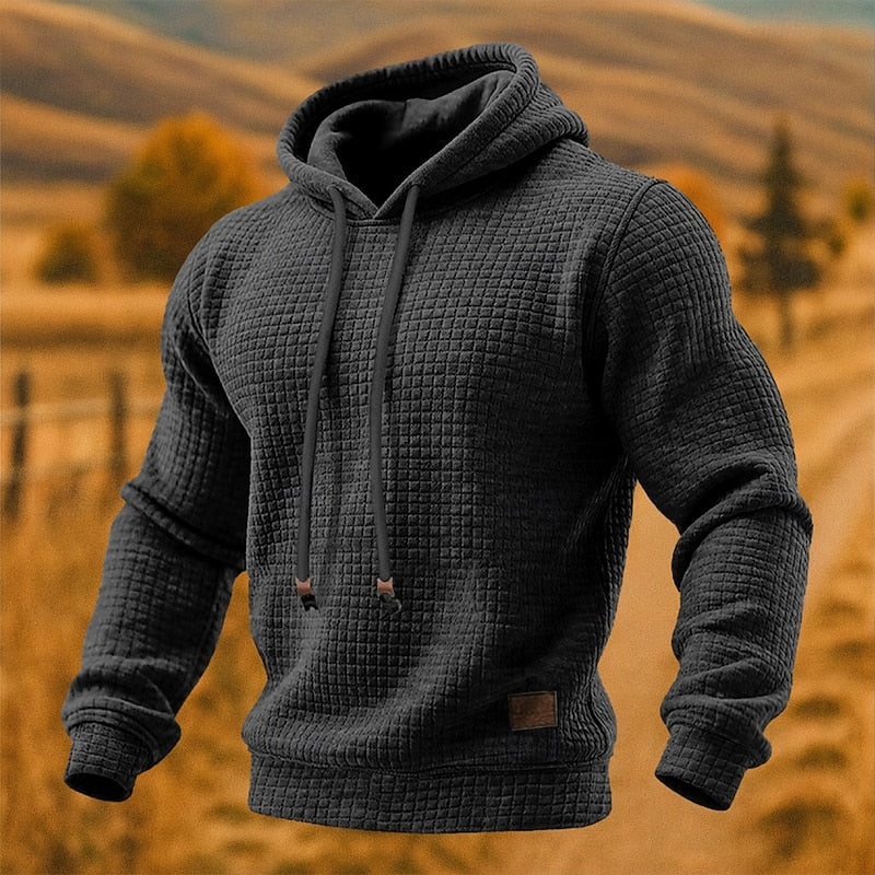 Waffle-Knit Pullover Hoodie – Black waffle-knit hoodie with drawcords and ribbed cuffs